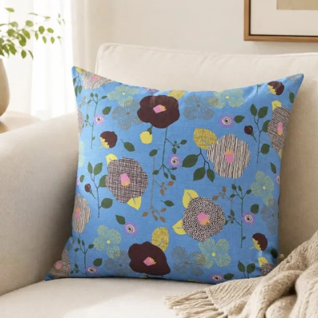 Sky Blue Botanical Bloom pillow cover on a cream armchair