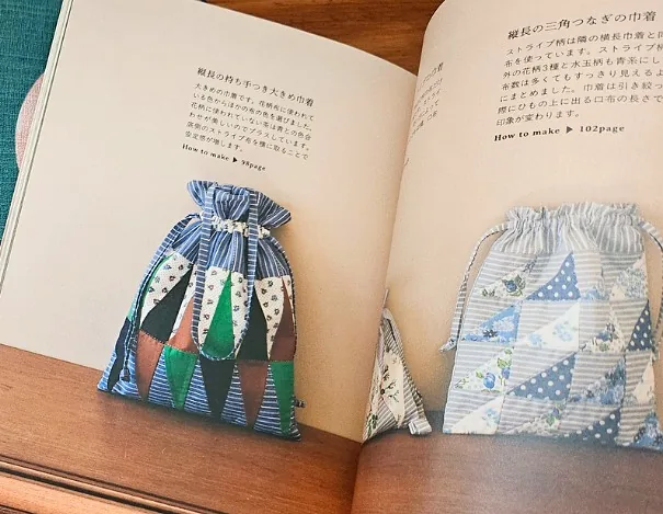 Japanese craft book open to patchwork drawstring bag projects