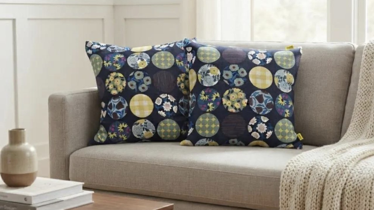 Two Circle Bloom Midnight Indigo Kyoto cotton pillow covers on a linen sofa